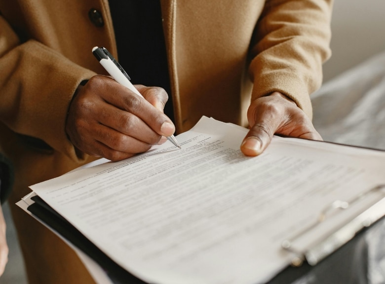 person signing papers